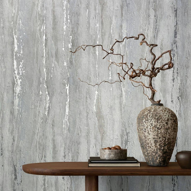 Vliestapete mit glänzender, grober Struktur grau Putzoptik